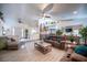 Bright and airy living room featuring vaulted ceilings, ceiling fans, and tile floors at 8610 Mohawk St, Las Vegas, NV 89139