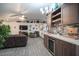 Cozy living room features wet bar, ceiling fan, and decorative shelving at 8610 Mohawk St, Las Vegas, NV 89139