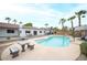 Inviting backyard pool and patio, surrounded by palm trees, perfect for relaxation and entertainment at 8610 Mohawk St, Las Vegas, NV 89139