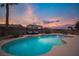 Backyard pool and lounge area under a colorful sky, perfect for relaxing or entertaining guests in the desert at 8610 Mohawk St, Las Vegas, NV 89139