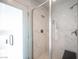 Elegant walk-in shower features sleek glass doors and marble-look tile at 8610 Mohawk St, Las Vegas, NV 89139