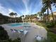 Resort-style pool area with lounge chairs, palm trees, and a relaxing atmosphere at 8985 S Durango Dr # 1033, Las Vegas, NV 89113