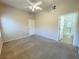Inviting primary bedroom with a ceiling fan and a private ensuite bathroom entrance at 8985 S Durango Dr # 1034, Las Vegas, NV 89113