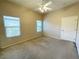 Neutral bedroom boasts two windows and a closet for optimal space and natural light at 8985 S Durango Dr # 1034, Las Vegas, NV 89113