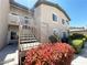 Exterior of the home with well maintained landscaping and stairs leading to the upper units at 8985 S Durango Dr # 1034, Las Vegas, NV 89113