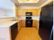 Functional kitchen features a full suite of appliances and warm wooden cabinetry at 8985 S Durango Dr # 1034, Las Vegas, NV 89113