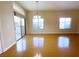 Open concept living room with bamboo flooring and sliding door to balcony at 8985 S Durango Dr # 1034, Las Vegas, NV 89113