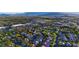 An aerial view of a neighborhood with lush landscaping and nearby shopping centers at 921 Granger Farm Way, Las Vegas, NV 89145