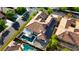 Aerial view of a luxury home and pool with solar panels and lush landscaping at 921 Granger Farm Way, Las Vegas, NV 89145
