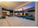 Expansive backyard with a covered patio, pool, spa, and beautifully designed landscaping at 921 Granger Farm Way, Las Vegas, NV 89145