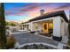 Beautiful backyard area with covered patio, lush landscaping, and a sparkling pool at 921 Granger Farm Way, Las Vegas, NV 89145