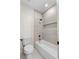Bright bathroom features white tile surround, gold hardware, and a soaking tub at 921 Granger Farm Way, Las Vegas, NV 89145