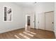 An empty bedroom with wood floors, white walls, and bright windows ready for its new owner at 921 Granger Farm Way, Las Vegas, NV 89145