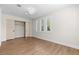 This is an empty bedroom with a large window and closet space to become the perfect bedroom at 921 Granger Farm Way, Las Vegas, NV 89145