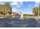 Welcome to Queensridge: A grand entrance featuring lush landscaping, decorative monuments, and a horse sculpture at 921 Granger Farm Way, Las Vegas, NV 89145