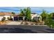 Charming single-story home featuring a three-car garage, tile roof, and well-maintained landscaping at 921 Granger Farm Way, Las Vegas, NV 89145