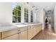 Hallway features lots of storage, wood-look floors, designer lighting, and beautiful countertops at 921 Granger Farm Way, Las Vegas, NV 89145