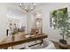 Bright office with a dark wood desk, chandelier, lots of light, and access to the rest of the house at 921 Granger Farm Way, Las Vegas, NV 89145