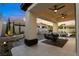 Relaxing covered patio with ceiling fans and an inviting seating area overlooking the yard at 921 Granger Farm Way, Las Vegas, NV 89145
