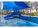 Shaded playground with multiple slides, perfect for to enjoy the outdoors at 921 Granger Farm Way, Las Vegas, NV 89145