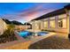 Beautiful backyard pool and spa area with a covered patio, perfect for entertaining at 921 Granger Farm Way, Las Vegas, NV 89145