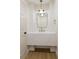 Stylish powder room features a modern sink, mirror, and a unique pendant light fixture at 921 Granger Farm Way, Las Vegas, NV 89145