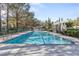 Relaxing lap pool surrounded by mature landscaping and shaded pergola area at 921 Granger Farm Way, Las Vegas, NV 89145