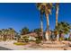 Charming single-story home featuring a meticulously landscaped front yard with mature palm trees at 9524 Quail Ridge Dr, Las Vegas, NV 89134