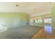 Bright living room with light green walls and a large window offering lots of natural light at 9524 Quail Ridge Dr, Las Vegas, NV 89134
