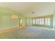 Bright and open living room with light green walls and a vaulted ceiling at 9524 Quail Ridge Dr, Las Vegas, NV 89134