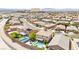 Expansive aerial view of a residential neighborhood featuring homes with pools and desert landscaping in the Las Vegas area at 9588 Vital Crest St, Las Vegas, NV 89123