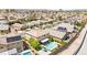 Sprawling neighborhood showcasing backyards with pools, desert landscaping, and convenient two-car garages at 9588 Vital Crest St, Las Vegas, NV 89123