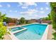 Stunning backyard pool and spa with lush landscaping, perfect for outdoor relaxation and entertaining at 9588 Vital Crest St, Las Vegas, NV 89123