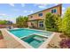 Beautiful backyard featuring a pool with integrated spa, patio, and a two-story home backdrop at 9588 Vital Crest St, Las Vegas, NV 89123
