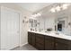 Bathroom features double sinks, decorative mirrors, and ample counter space at 9588 Vital Crest St, Las Vegas, NV 89123