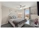 Cozy bedroom featuring a large window and decorative wall art at 9588 Vital Crest St, Las Vegas, NV 89123