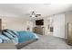 This bedroom features a modern sliding barn door to the ensuite bathroom with ample natural light at 9588 Vital Crest St, Las Vegas, NV 89123