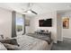 Bedroom featuring a large window, ceiling fan and decorative wall art at 9588 Vital Crest St, Las Vegas, NV 89123
