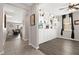 Open entryway with built-in shelving and hardwood floors, leading into the living area at 9588 Vital Crest St, Las Vegas, NV 89123
