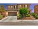 Charming two-story home with a two-car garage and well-maintained landscaping at 9588 Vital Crest St, Las Vegas, NV 89123