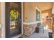 Inviting front porch with decorative stone accents and a charming sunflower wreath at 9588 Vital Crest St, Las Vegas, NV 89123