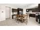 Spacious kitchen with a central island, stainless steel appliances, and adjacent dining area at 9588 Vital Crest St, Las Vegas, NV 89123