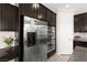 The kitchen features dark cabinets, stainless steel appliances, and a built-in oven at 9588 Vital Crest St, Las Vegas, NV 89123
