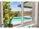 Framed view of the refreshing pool and the backyard, evoking a sense of outdoor oasis at 9588 Vital Crest St, Las Vegas, NV 89123