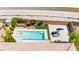 Inviting backyard pool area features an attached spa, an umbrella covered lounge, and manicured landscaping at 9588 Vital Crest St, Las Vegas, NV 89123