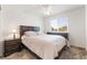 Bedroom with neutral tones and furniture, featuring a window and ceiling fan at 9636 Salford Isle St, Las Vegas, NV 89123