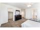 Spacious bedroom with a large closet, a dresser, and an ensuite bathroom with glass shower at 9636 Salford Isle St, Las Vegas, NV 89123