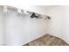 Walk-in closet with ample storage space and a rod for hanging clothes at 9636 Salford Isle St, Las Vegas, NV 89123