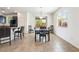 Dining area with tile flooring, a view of the backyard and large windows at 9636 Salford Isle St, Las Vegas, NV 89123
