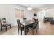 Inviting dining room with natural light, modern furnishings and open floorplan at 9636 Salford Isle St, Las Vegas, NV 89123
